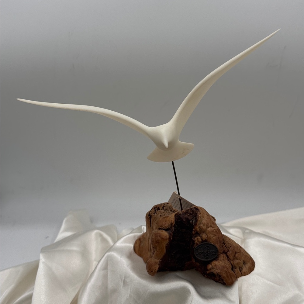 Lovely vintage mid century seagull sculpture on wood base by John Perry.